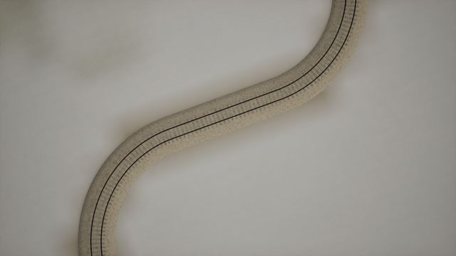 Top-down view of double railway track curving in an S-bend on pale ground.